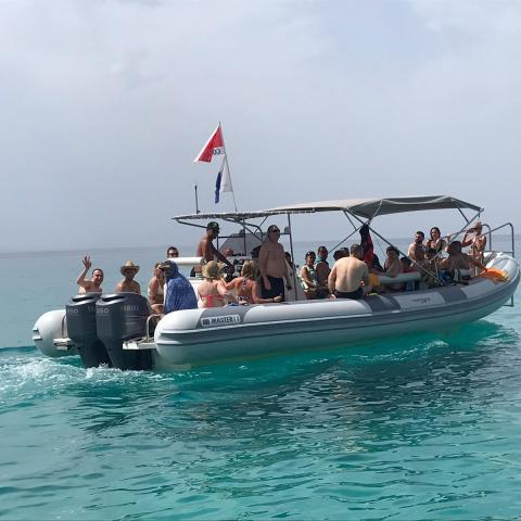 a group of people in a boat on a body of water