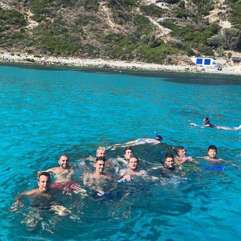 a group of people swimming in the water