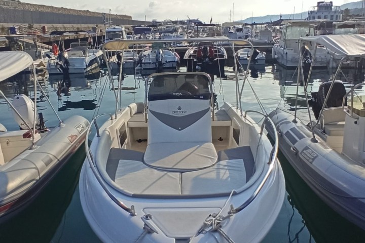 a boat is docked next to a body of water
