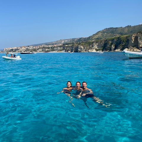 a group of people swimming in a body of water